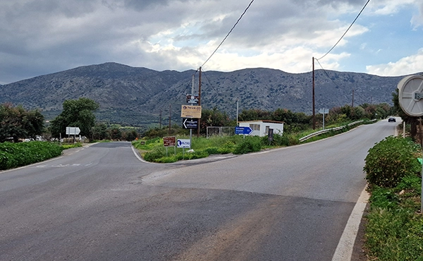 Road junction to Anogia village in Crete with mountain driving route