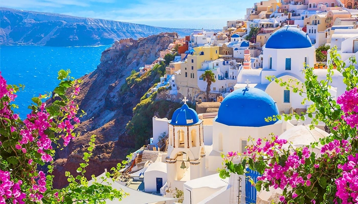 Oia Santorini caldera view with blue sea on a day trip from Crete
