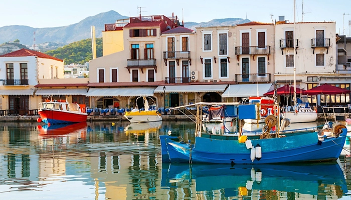 Rethymno old town harbor with boats in Crete