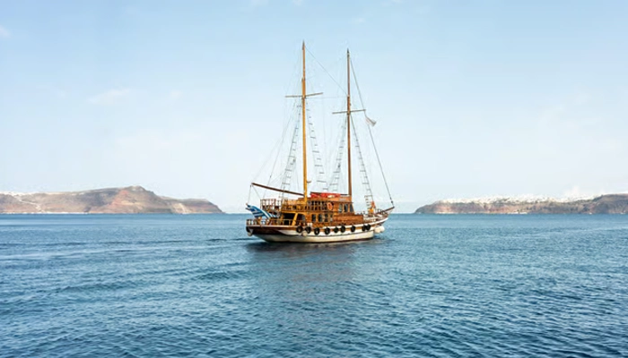 Santorini boat tour to Palea Kameni hot springs on a day trip from Crete