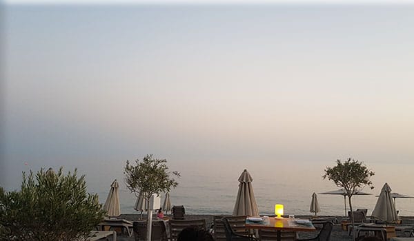 south crete sunset seaside taverna with olive trees