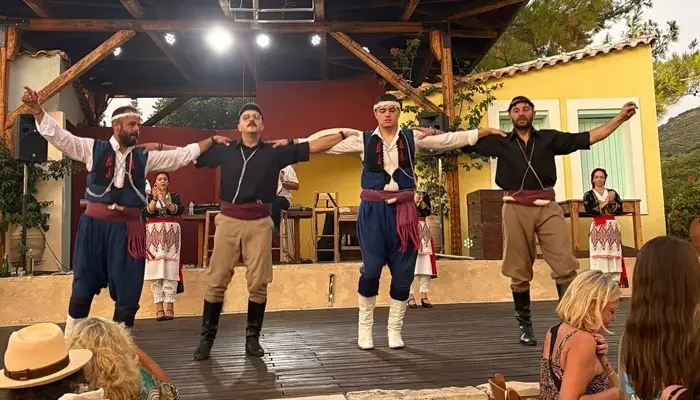 Traditional Cretan dancers in costumes performing during Cretan Night in Karouzanos village Crete