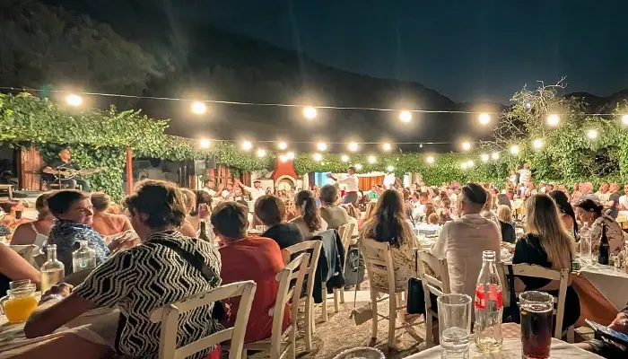 Guests applauding during Cretan Night dinner show in Karouzanos village Crete