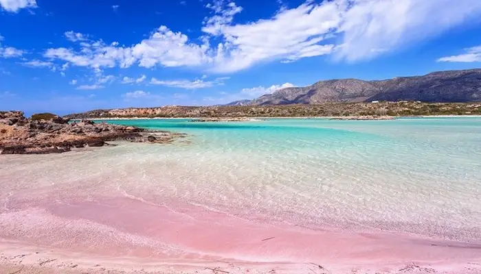 Elafonisi pink sand beach Crete with mountains and turquoise sea
