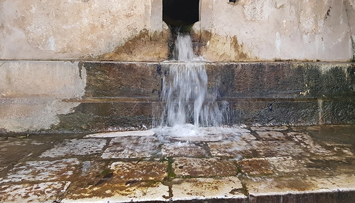 Stone fountain with natural spring water in Krasi village Crete during Lassithi Plateau tour