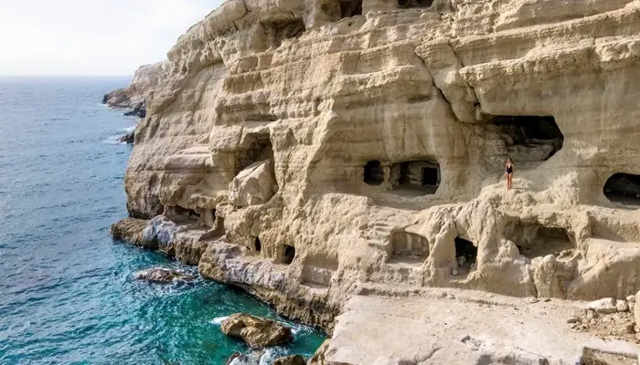 Matala beach rocks and sea in Crete during Matala Odigitria day trip with Car and Travel