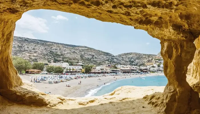 Matala caves view over beach and village in Crete during Matala Odigitria excursion with Car and Travel