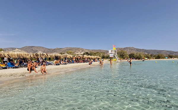 Elafonisi beach umbrellas and pink sand shoreline in Crete
